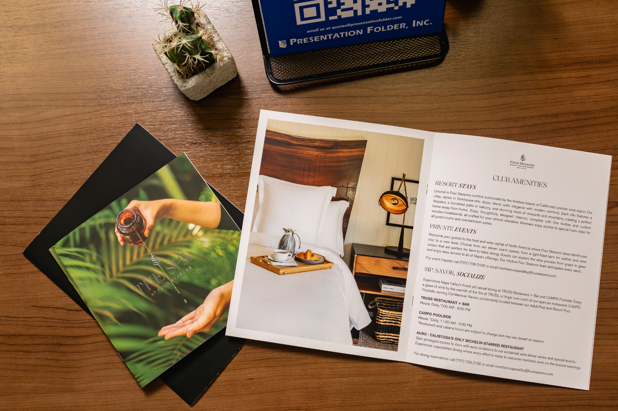 Custom printed presentation folder with branded inserts on a desk