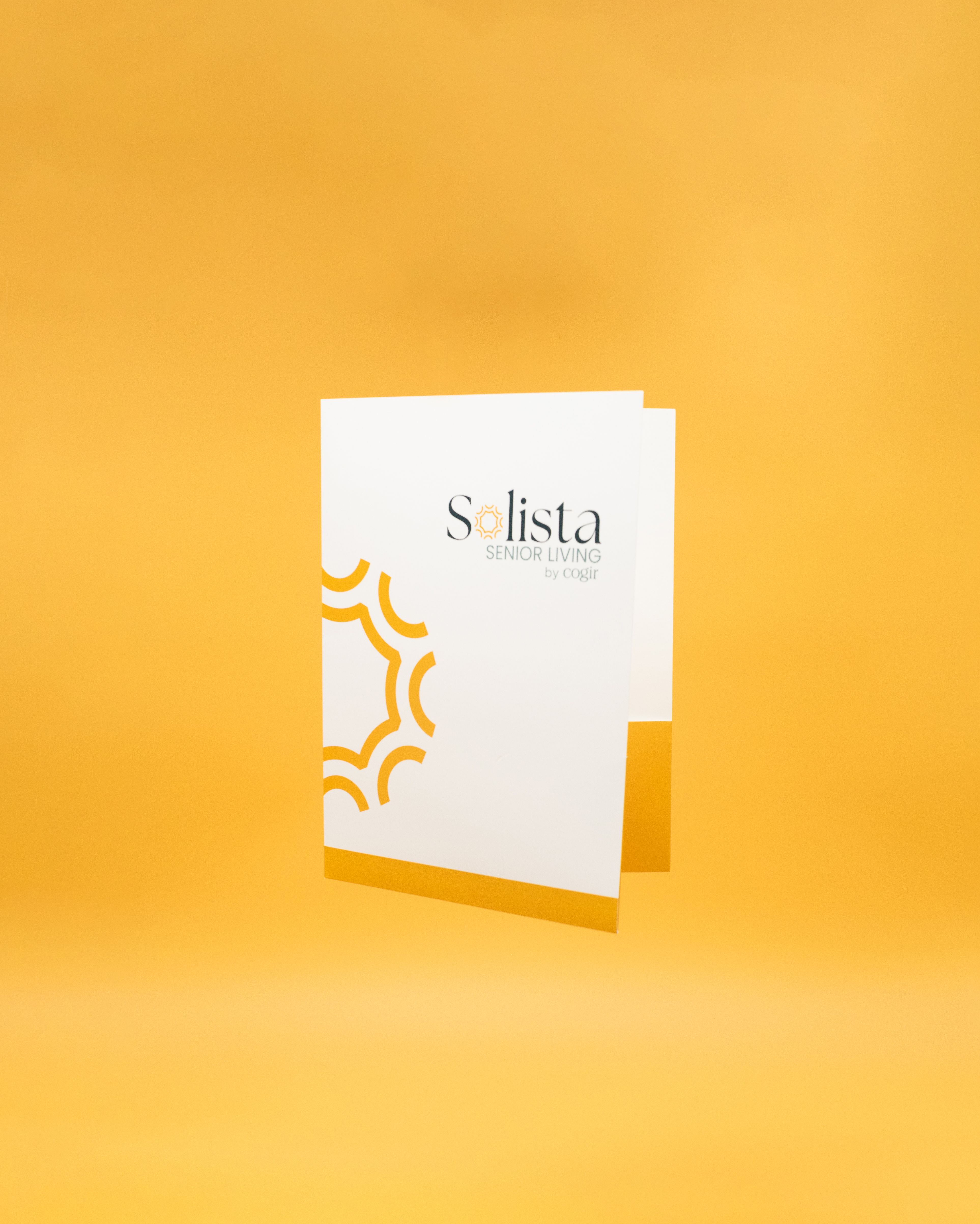 White presentation folder on yellow background